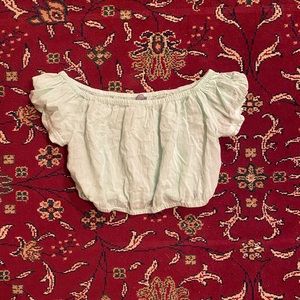 off the shoulder turquoise shirt